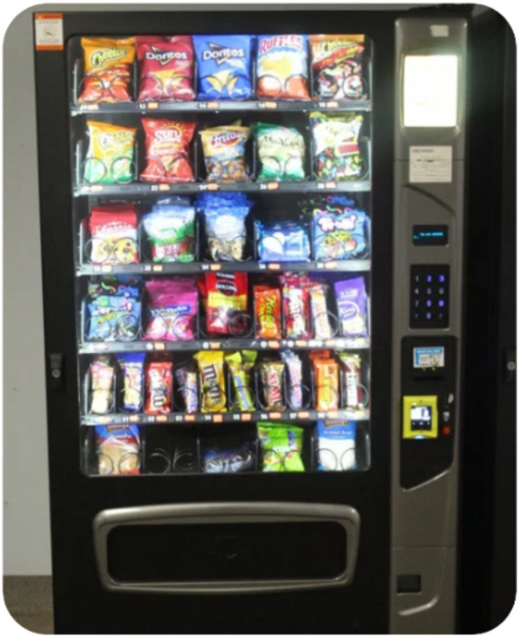 A modern glass-front snack vending machine, fully stocked